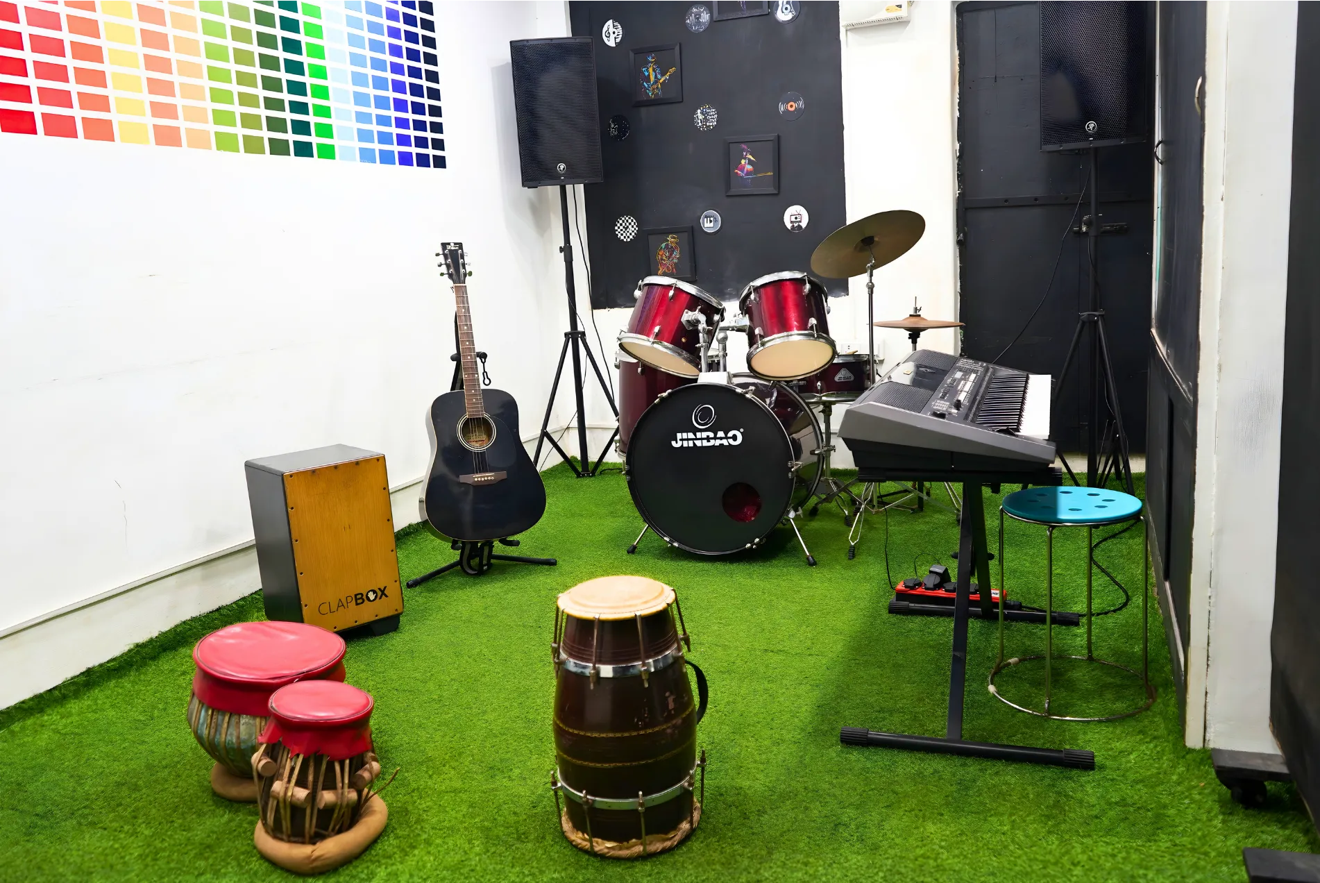 Jamming room with drum kit and guitars at Soundpoint Pro